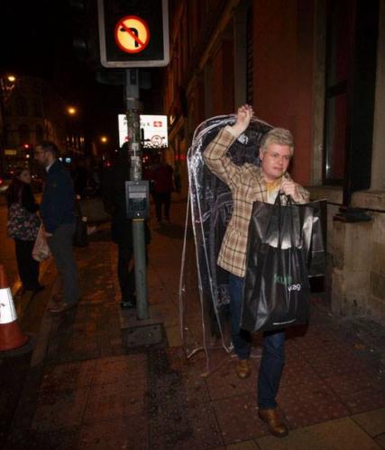 Phil taking Lady Gaga's purchases to her waiting limousine